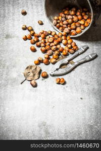 Nuts in the old pot. On the stone table.. Nuts in the old pot.