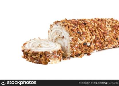 Nuts Swiss roll closeup isolated on a white background