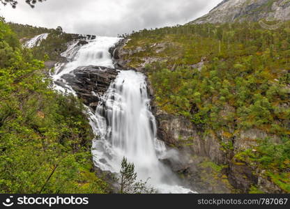 Nyastolfossen waterfall powerful streams in Husedalen valley, Kinsarvik, municipality Ullensvang, Hordaland county, Norway