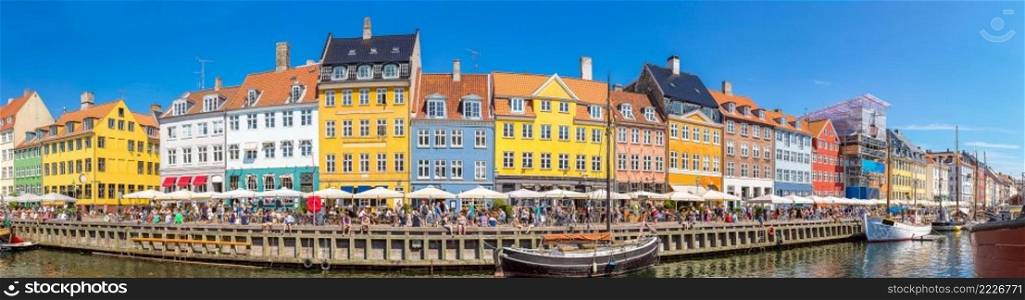 Nyhavn district is one of the most famous landmark in Copenhagen in a summer day