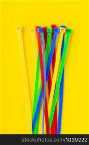 Nylon cable ties on a yellow background
