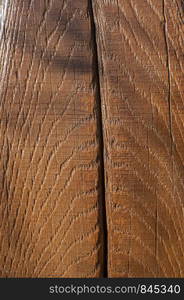 Oak wooden beam with polished surface and crack closeup