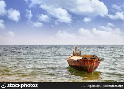 Oared fishing boat and sea