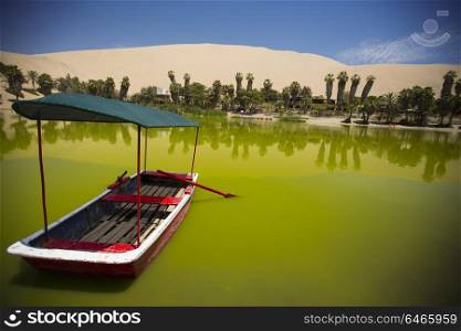 Oasis surrounded by sand dunes near Ica Peru