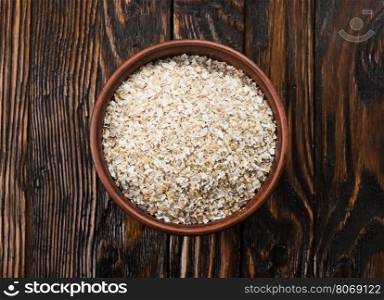 oat bran in bowl and on a table
