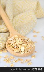 oat-flakes with a wooden spoon