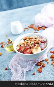 oat flakes with raisin and nuts in bowl