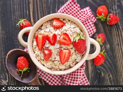 oat flakes with strawberry in the bowl