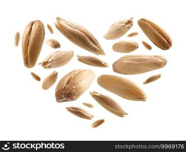 Oat grains in the shape of a heart on a white background.. Oat grains in the shape of a heart on a white background