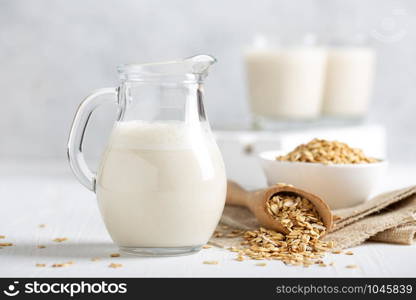 Oat milk. Healthy vegan non-dairy organic drink with flakes