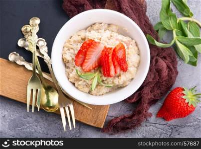 oat porridge in bowl and on a table