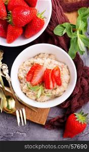 oat porridge in bowl and on a table