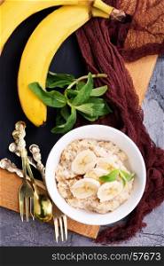 oat porridge with fresh banana in the bowl