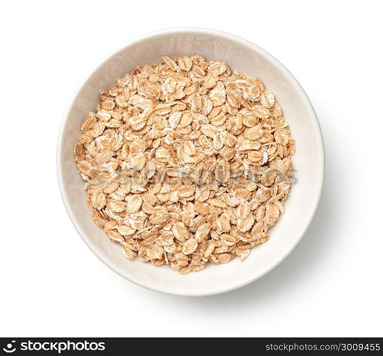 Oat rye flakes in bowl isolated on white background. Top view