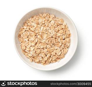 Oat rye flakes in bowl isolated on white background. Top view