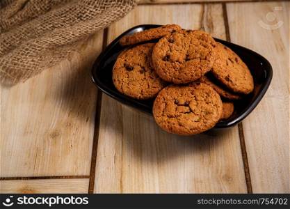 oatmeal cookies on wooden stand in rustic style