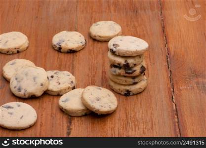 Oatmeal cookies with raisins on wooden old boards. oatmeal cookies on a wooden table