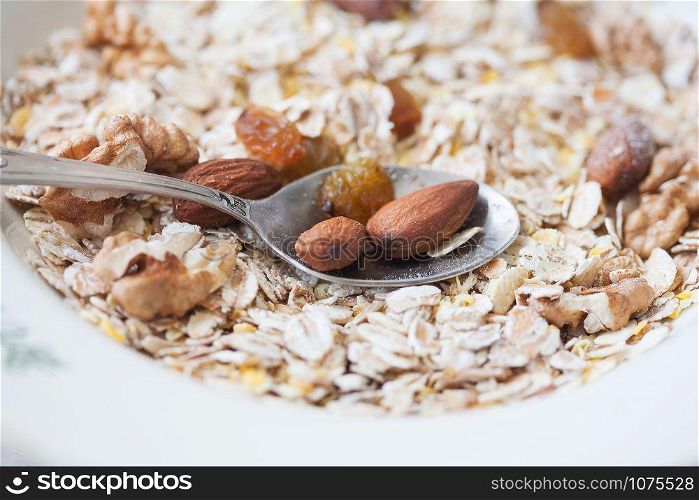 Oatmeal in bowl with nuts, useful food.. Oatmeal in bowl with nuts, useful food