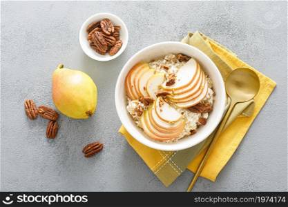 Oatmeal with cottage cheese, pecan nuts and pear for breakfast
