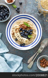 Oatmeal with fresh blueberries and pecans and banana