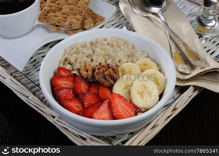 Oatmeal with fruit, coffee and orange juice