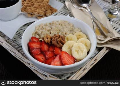 Oatmeal with fruit, coffee and orange juice