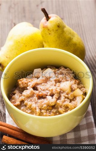 Oatmeal with pears and cinnamon on the table