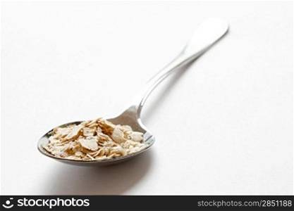 Oats in a heap isolated on white