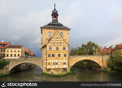 Obere bridge (brucke) and Altes Rathaus and cloudy sky in Bamberg, Germany&#xA;