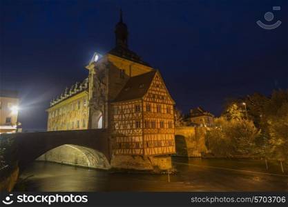 Obere bridge (brucke) and Altes Rathaus at night in Bamberg, Germany