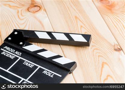 object close-up open video clapper without inscriptions on wooden boards kind