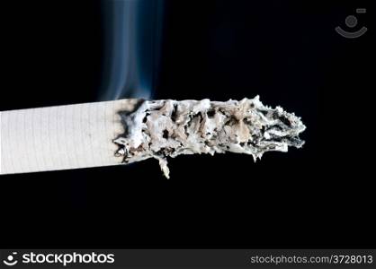 object on black - cigarette with smoke
