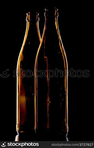 object on black - Empty beer bottle