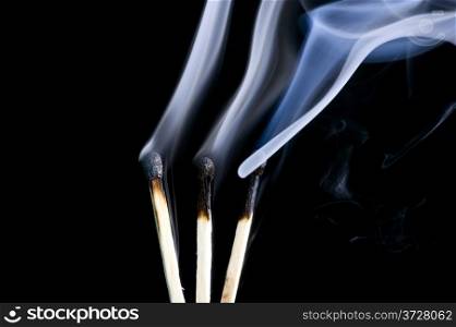 object on black - match with smoke