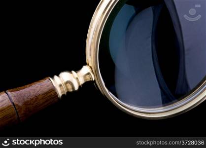 object on black - tool magnifying glass