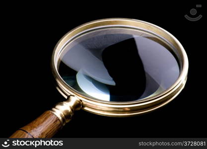 object on black - tool magnifying glass