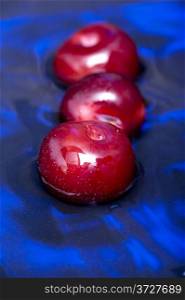 object on blue - food plum in the water