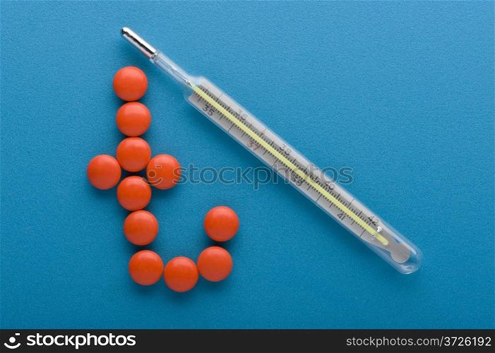 object on blue - medical Tablet and thermometer