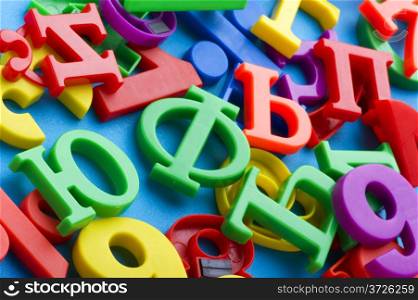 object on blue - toy plastic letters and numbers