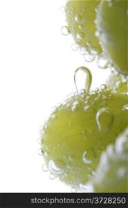 object on white - Green grapes in water