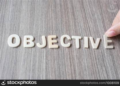 OBJECTIVE word of wooden alphabet letters. Business and Idea concept