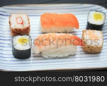 Oblong Japanese plate with traditional Sushi