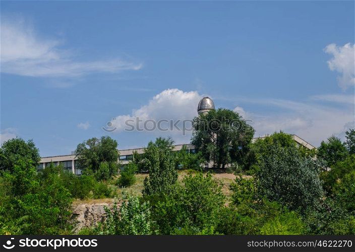 observatory on the background of blue sky with trees