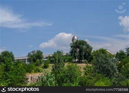 observatory on the background of blue sky with trees