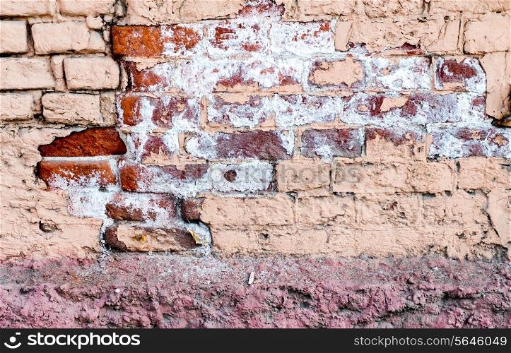 Obsolete old brick wall texture with print of old paint