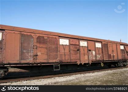 Obsolete wooden cargo railway wagon in perspective view