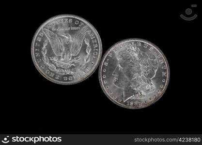 Obverse and Reverse of American Silver Dollar isolated on Black Background