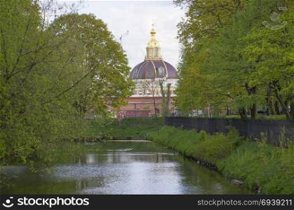 Obvodny Canal protected old unplastered buildings from a red brick Admiralty warehouses in Kronddshtat Russia