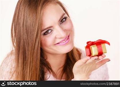 Occasions gifts people concept. Christmas xmas winter season. Lovely woman with golden box gift with red bow. Lovely woman with golden box gift