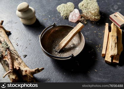 occult science and supernatural concept - palo santo stick in cup and staff for magic ritual. palo santo stick in cup and staff for magic ritual